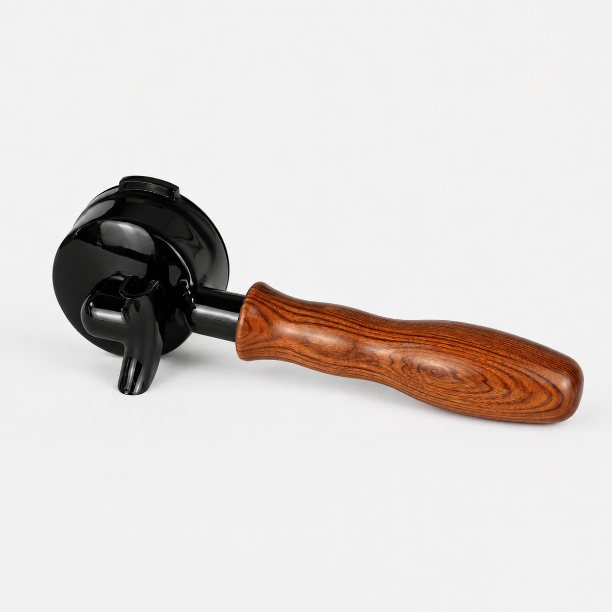 A coffee portafilter with a glossy black metal body and a curved brown wooden handle, shown on a light gray background.